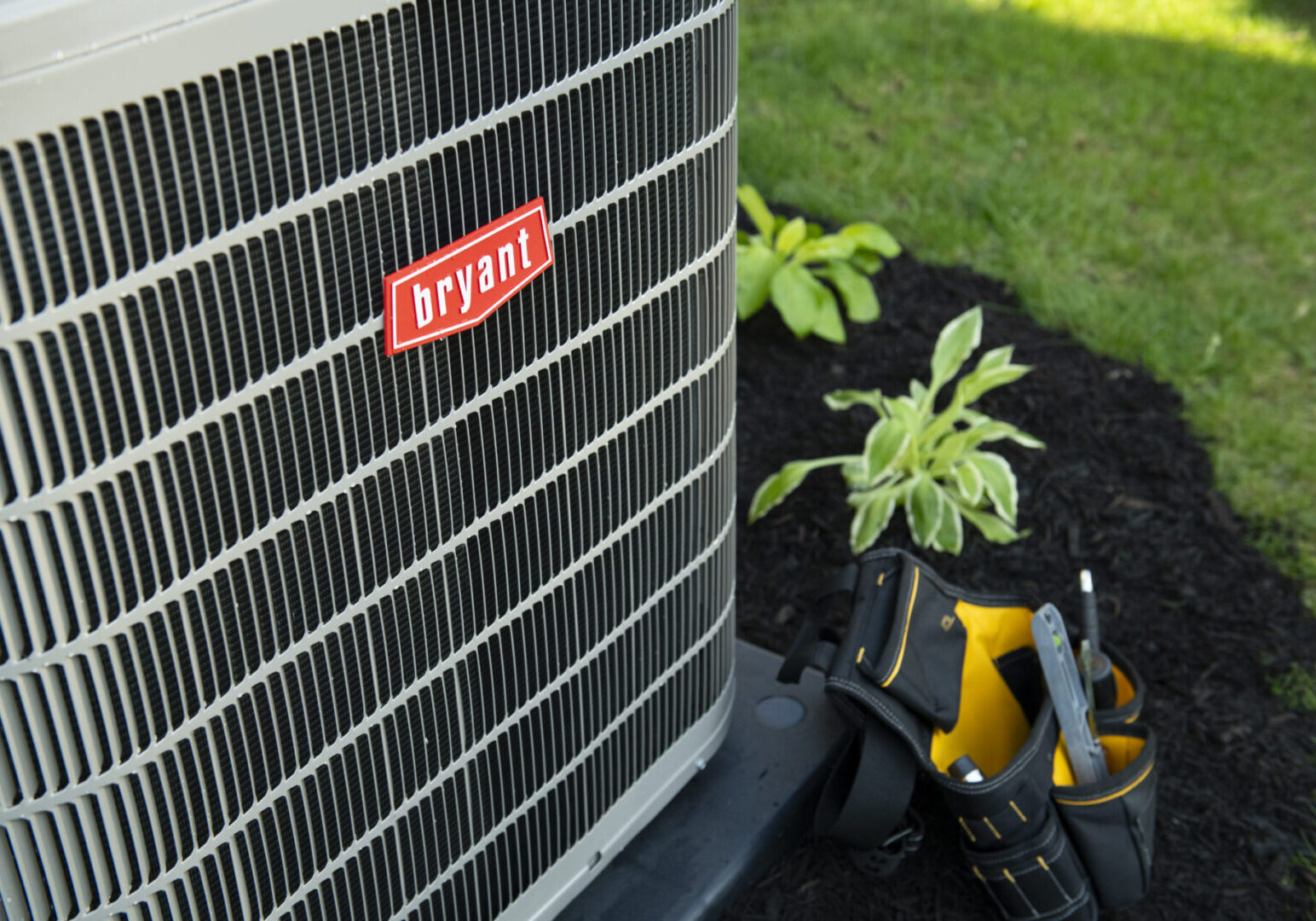 Air conditioning unit with tools nearby.