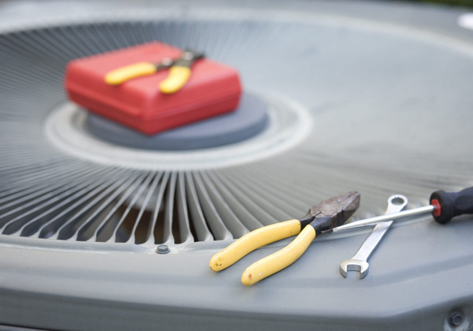 Tools on air conditioning unit.